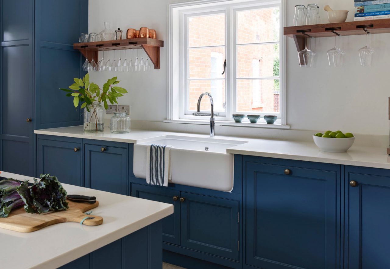 Blue and white traditional hand-made kitchen with composite worktop and island unit