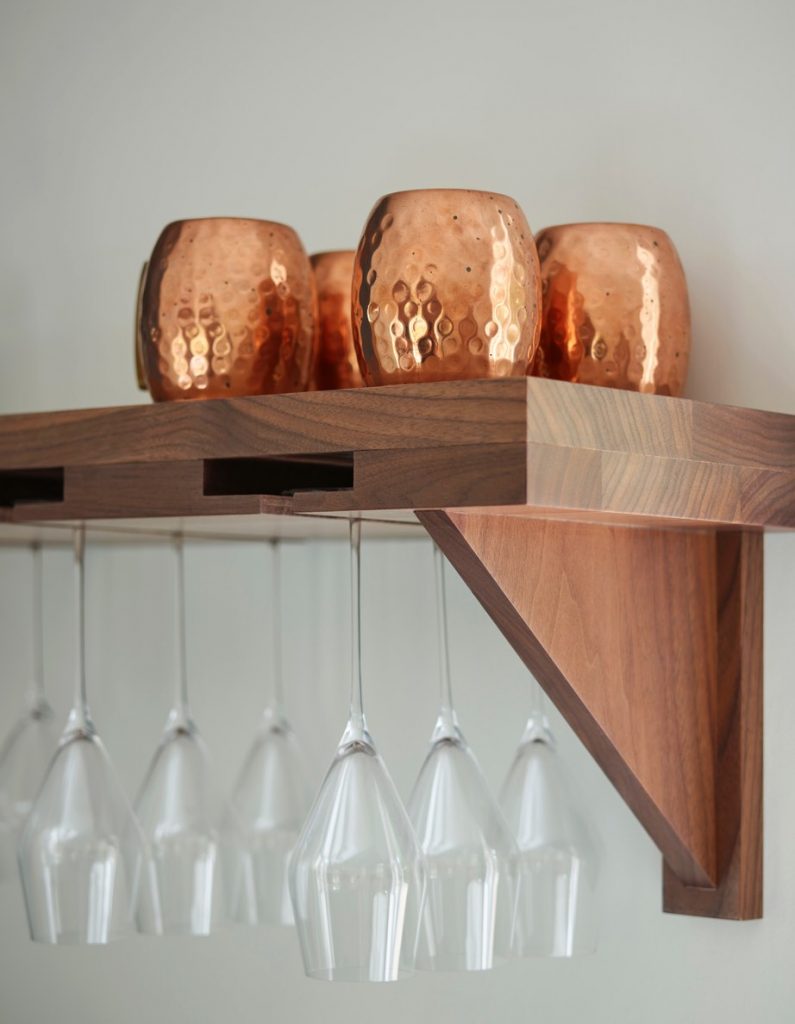 Custom walnut shelf with integrated up-side down wine holder